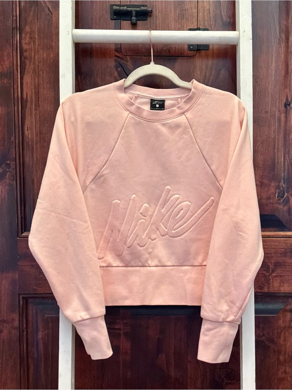 Nike Women's Light Pink Embossed Logo Crewneck Sweatshirt